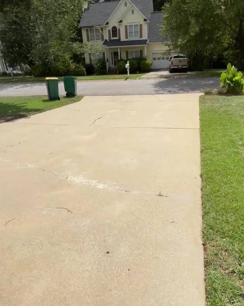 Long driveway after washing, warm clean concrete